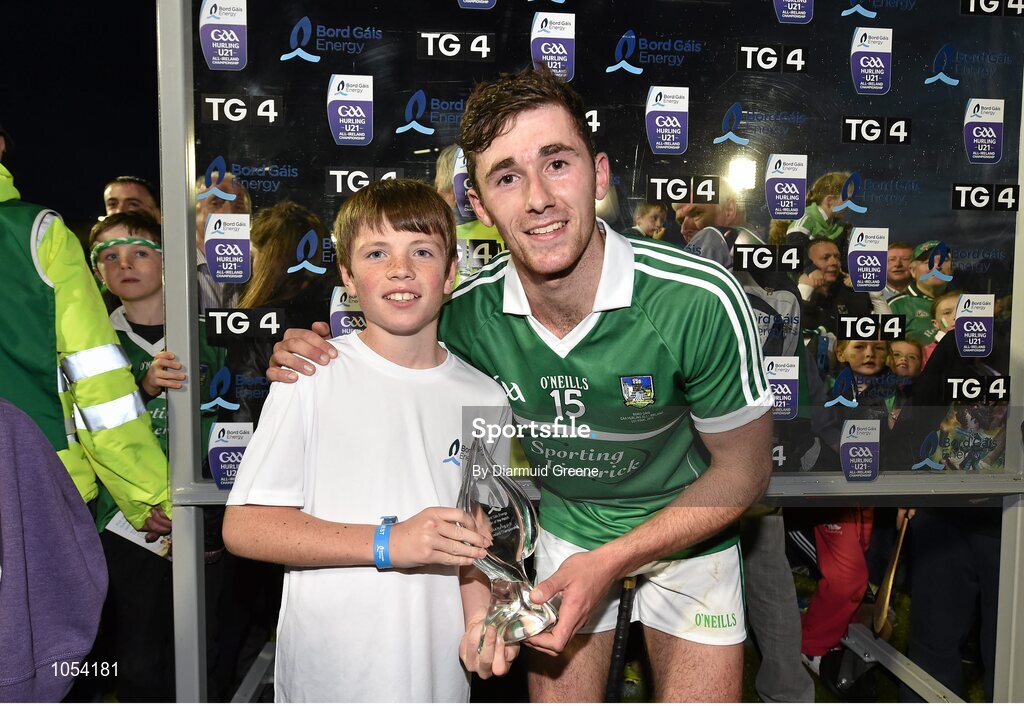 12 September 2015; Limerick's Barry Nash is presented with the Bord Gais Energy man of the match award by Oisín Kirwan, aged 12, from Kilmacud Crokes GAA club, who won a competition to present the award through the Bord Gais Energy Rewards club. Bord Gais Energy GAA Hurling All-Ireland U21 Championship Final, Limerick v Wexford, Semple Stadium, Thurles, Co. Tipperary. Picture credit: Diarmuid Greene / SPORTSFILE