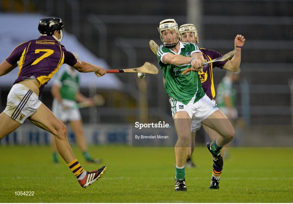 12 September 2015; Cian Lynch, Limerick, has his shot blocked by Jack O'Connor, Wexford. Bord Gais Energy GAA Hurling All-Ireland U21 Championship Final, Limerick v Wexford, Semple Stadium, Thurles, Co. Tipperary. Picture credit: Brendan Moran / SPORTSFILE