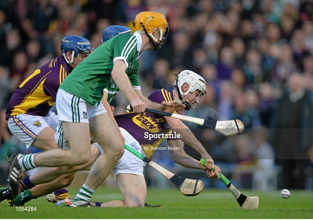 12 September 2015; Cathal Dunbar, Wexford, has a shot on goal despite the attentions of Richie English, Limerick. Bord Gais Energy GAA Hurling All-Ireland U21 Championship Final, Limerick v Wexford, Semple Stadium, Thurles, Co. Tipperary. Picture credit: Brendan Moran / SPORTSFILE
