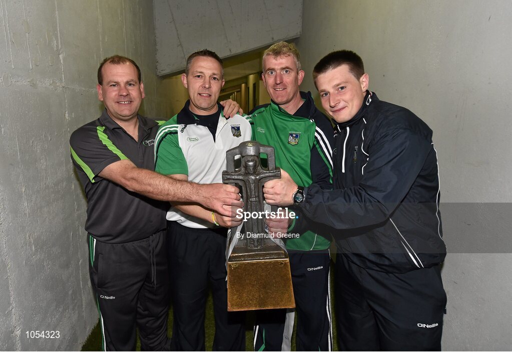12 September 2015; Members of the Limerick management team, from left to right, selector Jimmy Quilty, coach John Flavin, manager John Kiely, and strength and conditioning coach Ross Flavin celebrate with the trophy after victory over Wexford. Bord Gais Energy GAA Hurling All-Ireland U21 Championship Final, Limerick v Wexford, Semple Stadium, Thurles, Co. Tipperary. Picture credit: Diarmuid Greene / SPORTSFILE