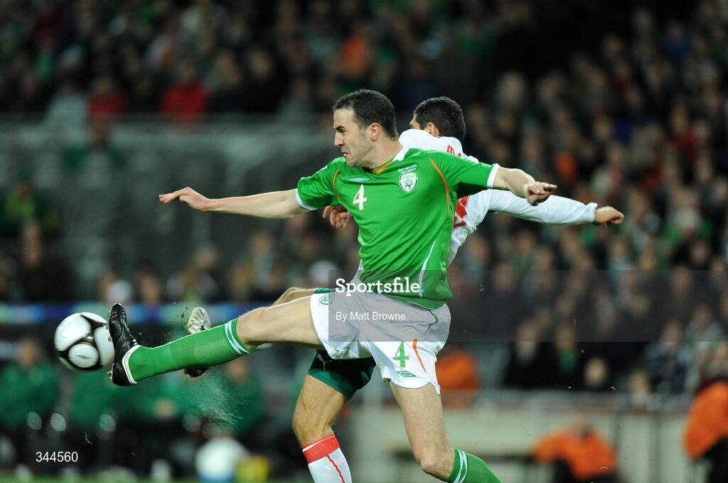 28 March 2009; John O'Shea, Republic of Ireland, in action against Dimitar Makriev, Bulgaria. 2010 FIFA World Cup Qualifier, Republic of Ireland v Bulgaria, Croke Park, Dublin. Picture credit: Matt Browne / SPORTSFILE