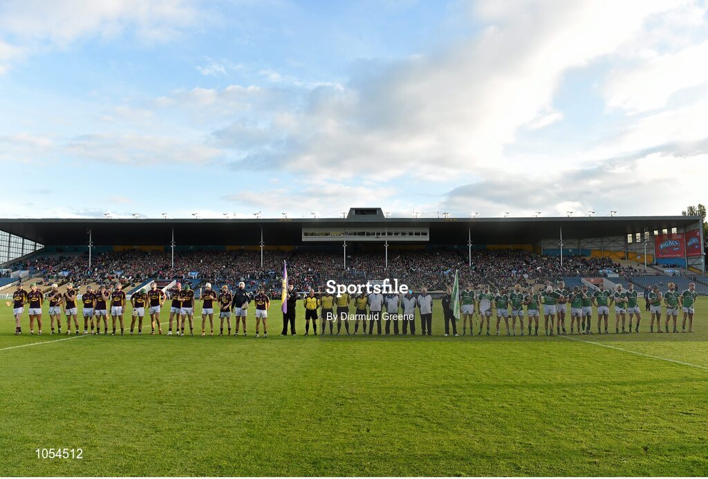 12 September 2015; The Wexford and Limerick teams, along with referee Johnny Ryan and his match officials, line up for the respect handshake before the game. Bord Gais Energy GAA Hurling All-Ireland U21 Championship Final, Limerick v Wexford, Semple Stadium, Thurles, Co. Tipperary. Picture credit: Diarmuid Greene / SPORTSFILE
