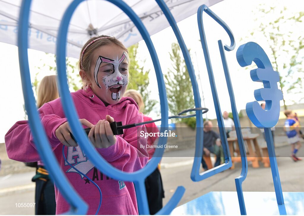 12 September 2015; Aoibhe Richardson, aged 6, from Cuala GAA club, Dublin, tries her hand at the buzzer game in the Bord Gais Energy fanzone before the game. Bord Gais Energy GAA Hurling All-Ireland U21 Championship Final, Limerick v Wexford, Semple Stadium, Thurles, Co. Tipperary. Picture credit: Diarmuid Greene / SPORTSFILE