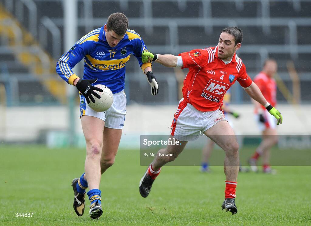 29 March 2009; Kevin Mulryan, Tipperary, in action against John O'Brien, Louth. Allianz GAA NFL Division 3, Round 6, Tipperary v Louth, Semple Stadium, Thurles, Co. Tipperary. Picture credit: Matt Browne / SPORTSFILE