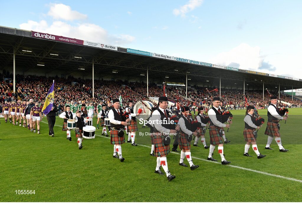 12 September 2015; The Wexford and Limerick teams are led by the Diarmuid O'Hurley Pipe Band during the pre-match parade. Bord Gais Energy GAA Hurling All-Ireland U21 Championship Final, Limerick v Wexford, Semple Stadium, Thurles, Co. Tipperary. Picture credit: Diarmuid Greene / SPORTSFILE