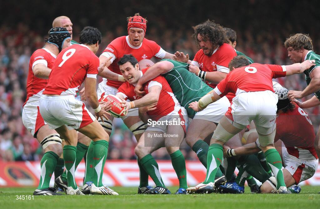 21 March 2009; Stephen Jones, Wales, is tackled by John Hayes, Ireland. RBS Six Nations Championship, Wales v Ireland, Millennium Stadium, Cardiff, Wales. Picture credit: Matt Browne / SPORTSFILE