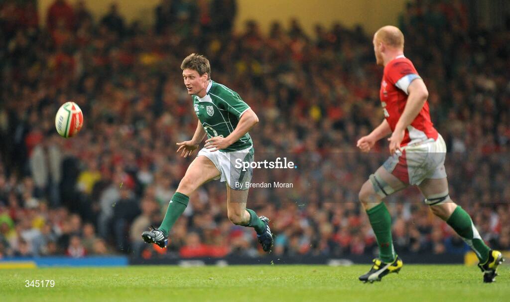 21 March 2009; Ronan O'Gara, Ireland, kicks through against Martyn Williams, Wales. RBS Six Nations Championship, Wales v Ireland, Millennium Stadium, Cardiff, Wales. Picture credit: Brendan Moran / SPORTSFILE