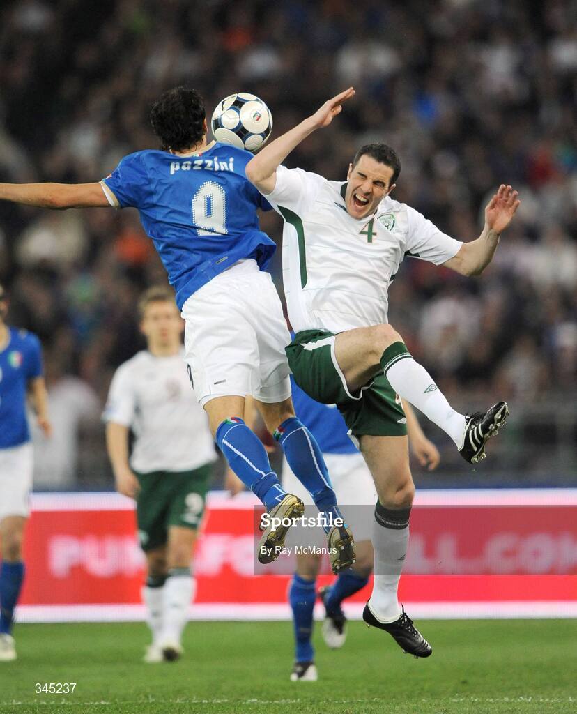 1 April 2009; John O'Shea, Republic of Ireland, clashes with Italy's Giampaolo Pazzini, who was subsequently sent off. 2010 FIFA World Cup Qualifier, Italy v Republic of Ireland, San Nicola Stadium, Bari, Italy. Picture credit: Ray McManus / SPORTSFILE