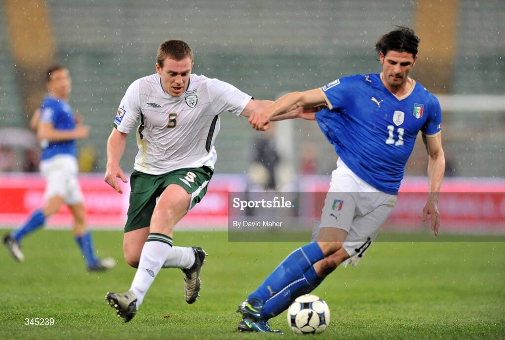 1 April 2009; Richard Dunne, Republic of Ireland, in action against Vincenzo Iaquinta, Italy. 2010 FIFA World Cup Qualifier, Italy v Republic of Ireland, San Nicola Stadium, Bari, Italy. Picture credit: David Maher / SPORTSFILE