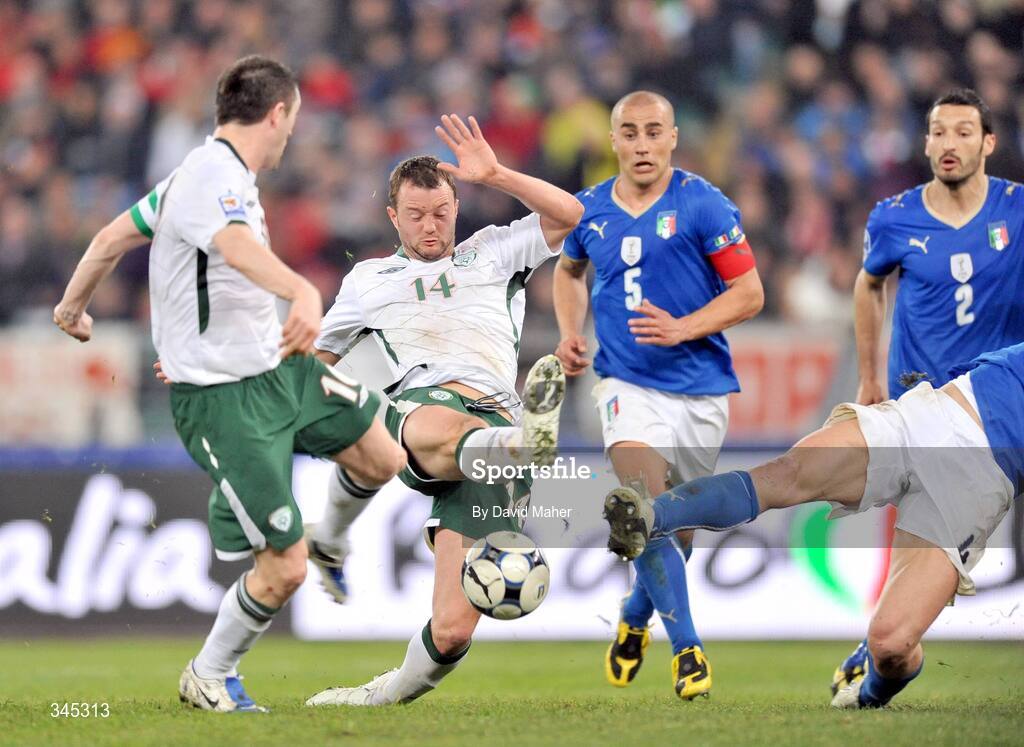 1 April 2009; Republic of Ireland's Robbie Keane, left, shoots to score his side's equalising goal. 2010 FIFA World Cup Qualifier, Italy v Republic of Ireland, San Nicola Stadium, Bari, Italy. Picture credit: David Maher / SPORTSFILE