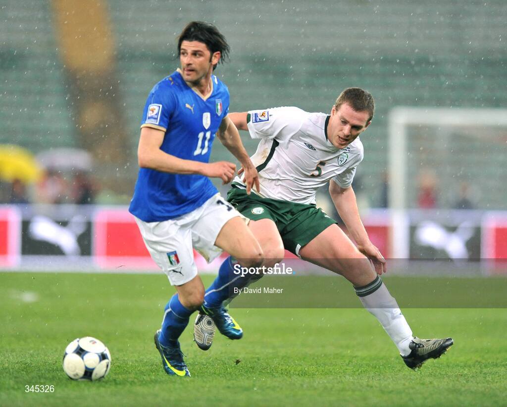 1 April 2009; Richard Dunne, Republic of Ireland, in action against Vincenzo Iaquinta, Italy. 2010 FIFA World Cup Qualifier, Italy v Republic of Ireland, San Nicola Stadium, Bari, Italy. Picture credit: David Maher / SPORTSFILE