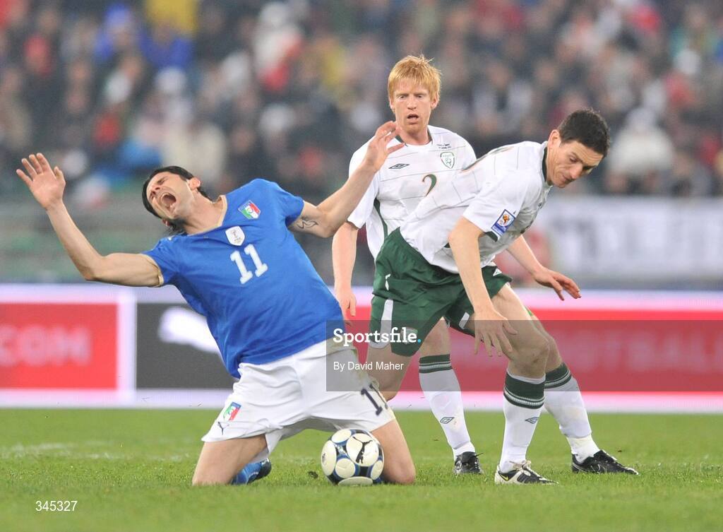 1 April 2009; Keith Andrews, Republic of Ireland, in action against Vincenzo Iaquinta, Italy. 2010 FIFA World Cup Qualifier, Italy v Republic of Ireland, San Nicola Stadium, Bari, Italy. Picture credit: David Maher / SPORTSFILE