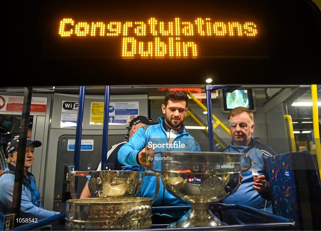 21 September 2015; Dublin's Cian O'Sullivan puts the Sam Maguire cup back on the bus after the team homecoming. O'Connell St, Dublin. Photo by Sportsfile