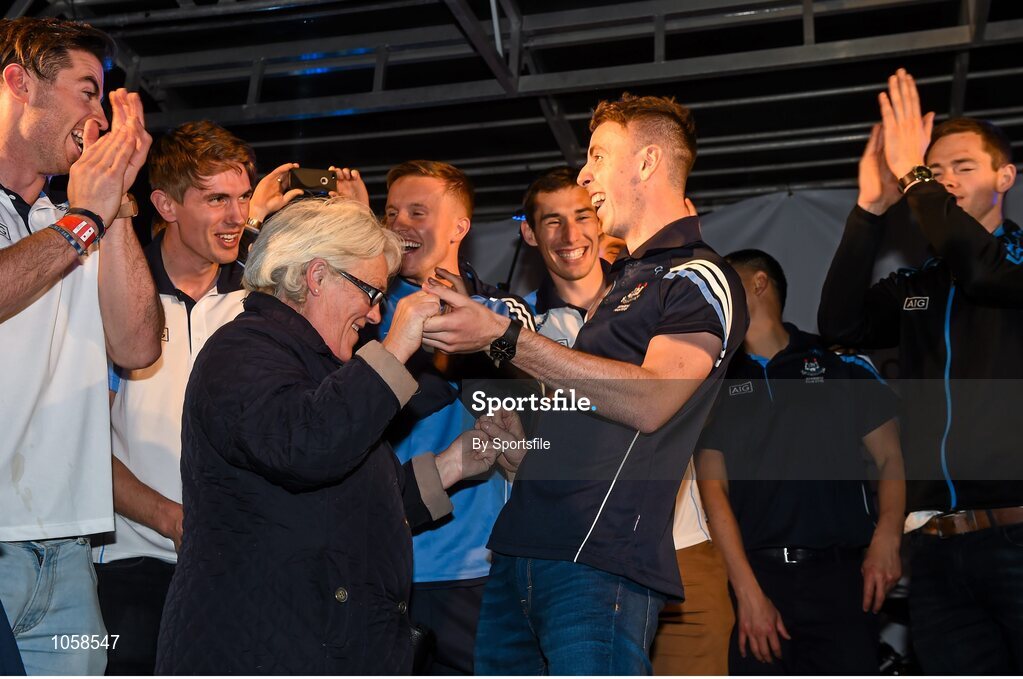 21 September 2015; Dublin's Cormac Costello dances on stage with Ann Grimes, from Dublin, during the team homecoming. O'Connell St, Dublin. Photo by Sportsfile
