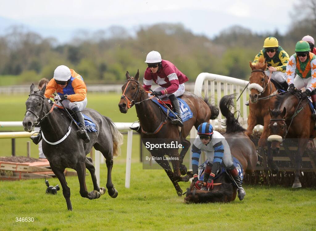 12 April 2009; Sarteano, with Roger Loughran up, races clear of the last on the way to winning the Lexeme Retail Novice Handicap Hurdle, as Pay The Ferryman, Paul Townend up, falls on landing beside eventual fourth-placed In The Haven, Davy Russell up. Fairyhouse, Co. Meath. Picture credit: Brian Lawless / SPORTSFILE *** Local Caption ***