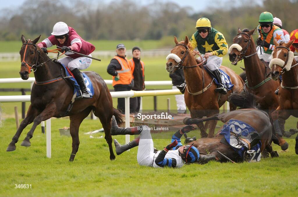 12 April 2009; Pay The Ferryman and jockey Paul Townend fall at the last during the Lexeme Retail Novice Handicap Hurdle. Fairyhouse, Co. Meath. Picture credit: Brian Lawless / SPORTSFILE *** Local Caption ***
