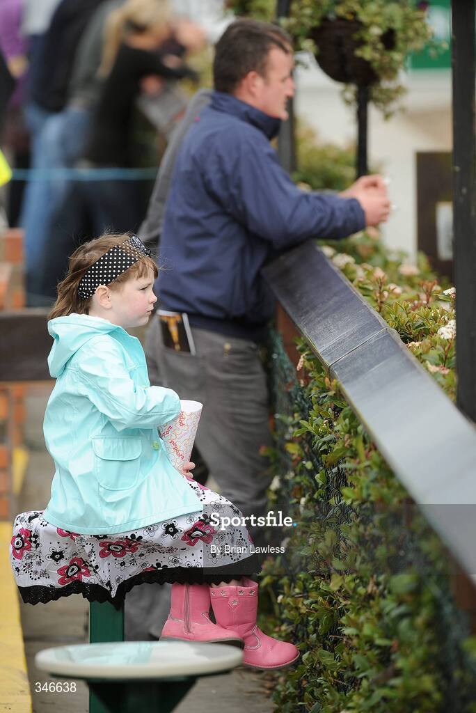 12 April 2009; A young race fan enjoys her popcorn as she keeps an eye on the parade ring ahead of the Lexeme Retail Novice Handicap Hurdle. Fairyhouse, Co. Meath. Picture credit: Brian Lawless / SPORTSFILE *** Local Caption ***