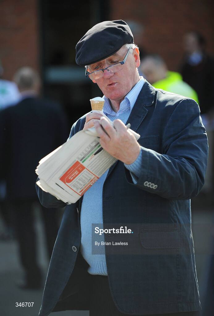 12 April 2009; A race fan studies the form while enjoying an ice cream ahead of the Powers Gold Cup. Fairyhouse, Co. Meath. Picture credit: Brian Lawless / SPORTSFILE *** Local Caption ***