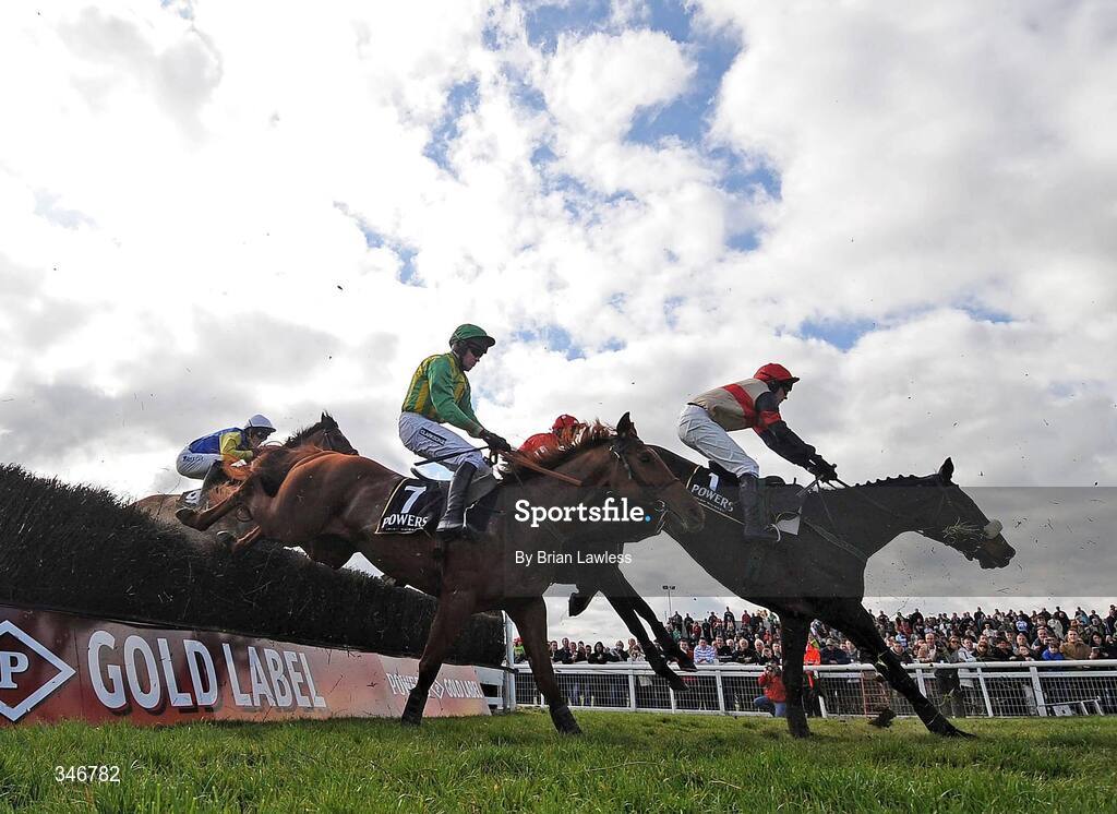 12 April 2009; Aran Concerto, with Paul Carberry up, right, clears the last 'first time around' on the way to winning the Powers Gold Cup. Fairyhouse, Co. Meath. Picture credit: Brian Lawless / SPORTSFILE