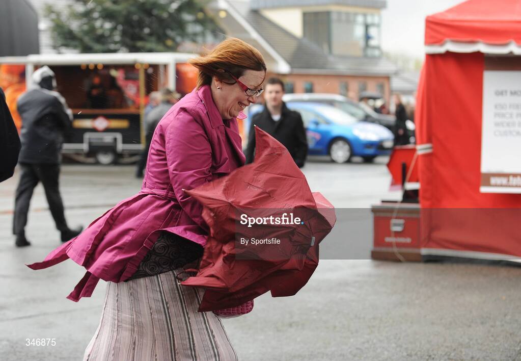 13 April 2009; A race fan struggles with her umbrella at Fairyhouse. Fairyhouse Racecourse, Co. Meath. Photo by Sportsfile