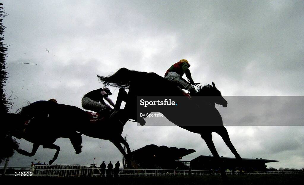 13 April 2009; Coolcashin, right, with Keith Clarke up, after jumping the last on the way to wining the Ladbrokes.com Hurdle ahead of second place Essex, no. 5, with Davy Russell up. Fairyhouse Racecourse, Co. Meath. Photo by Sportsfile