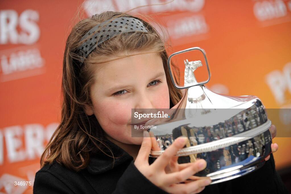 13 April 2009; Millie Regan, daughter of winning owner Graham Regan, celebrates with the cup after Niche Market won the Powers Whiskey Irish Grand National Steeplechase. Fairyhouse Racecourse, Co. Meath. Photo by Sportsfile