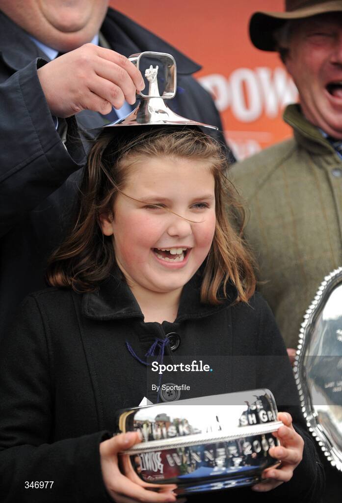 13 April 2009; Millie Regan, daughter of winning owner Graham Regan, celebrates with the cup after Niche Market won the Powers Whiskey Irish Grand National Steeplechase. Fairyhouse Racecourse, Co. Meath. Photo by Sportsfile