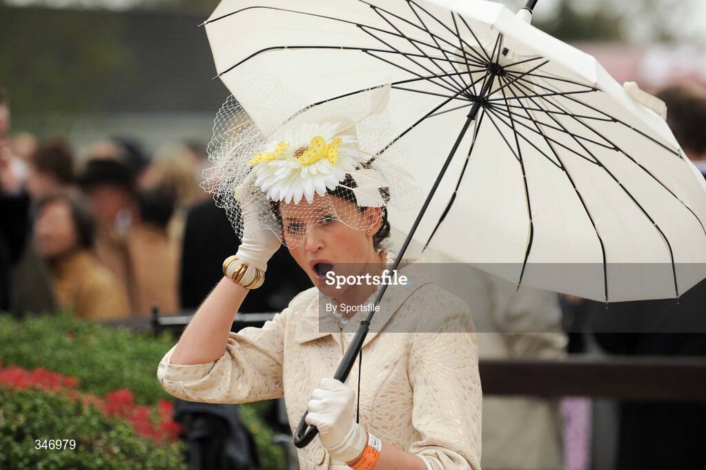 13 April 2009; Winner of the Powers Whiskey Most Stylish Lady Trisha Moore from Navan, Co. Meath holds on to her hat during the days racing at Fairyhouse. Fairyhouse Racecourse, Co. Meath. Photo by Sportsfile
