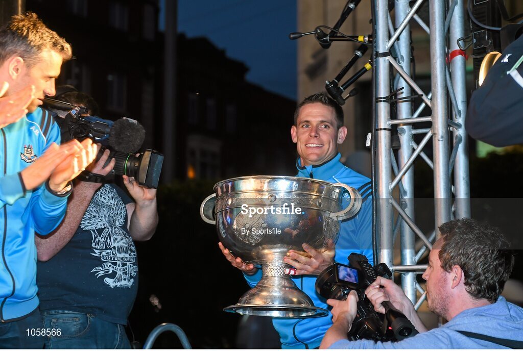 21 September 2015; Dublin's Stephen Cluxton brings the Sam Maguire cup onto the stage during the team homecoming. O'Connell St, Dublin. Photo by Sportsfile