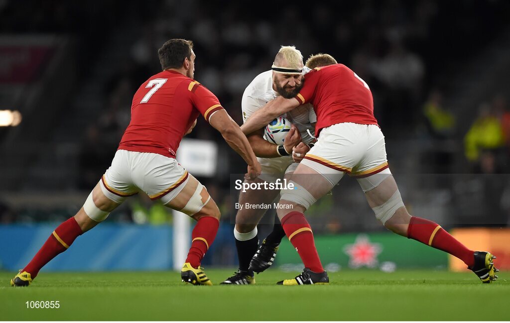 26 September 2015; Joe Marler, England, is tackled by Sam Warburton, left, and Bradley Davies, Wales. 2015 Rugby World Cup, Pool A, England v Wales, Twickenham Stadium, London, England. Picture credit: Brendan Moran / SPORTSFILE