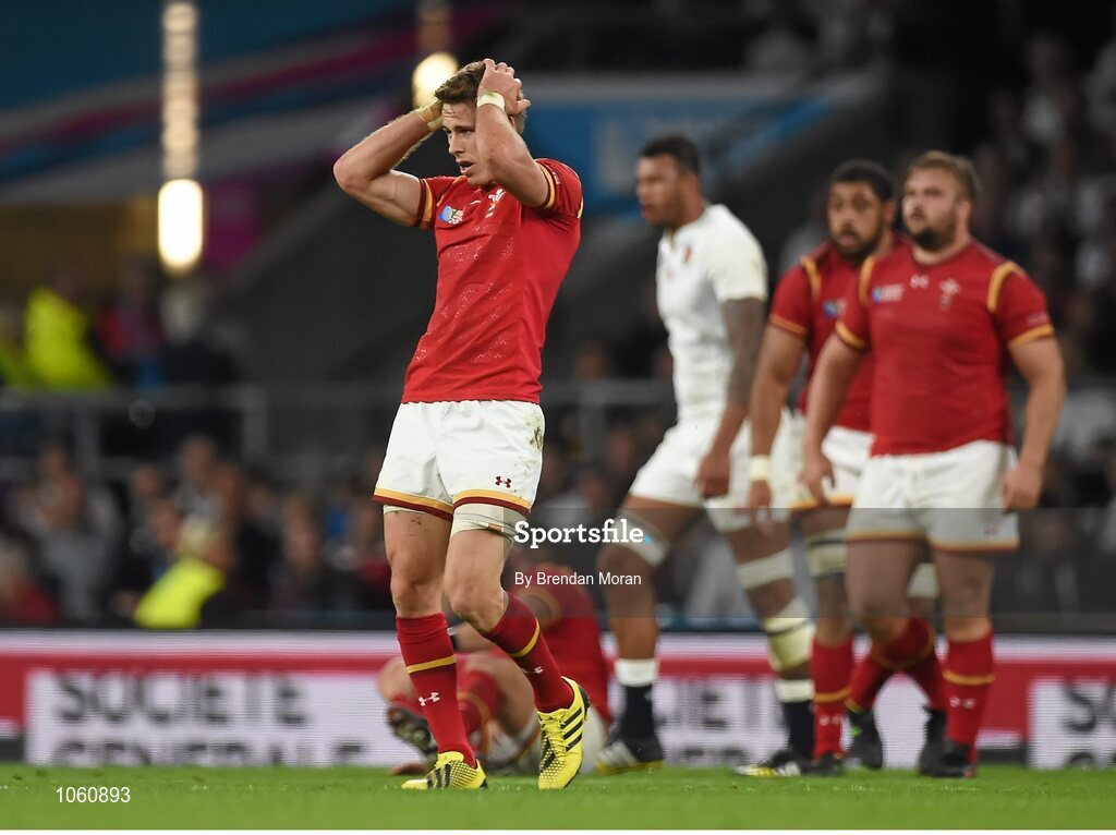 26 September 2015; Liam Williams, Wales, holds his head after a tackle by Owen Farrell, England. 2015 Rugby World Cup, Pool A, England v Wales, Twickenham Stadium, London, England. Picture credit: Brendan Moran / SPORTSFILE