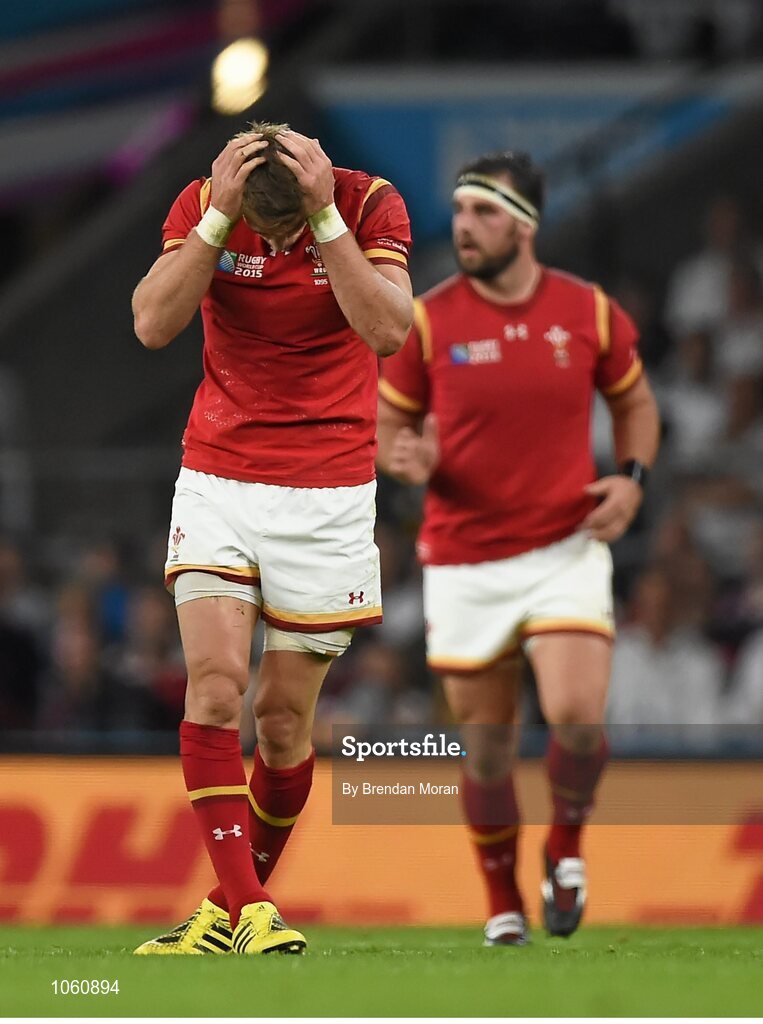 26 September 2015; Liam Williams, Wales, holds his head after a tackle by Owen Farrell, England. 2015 Rugby World Cup, Pool A, England v Wales, Twickenham Stadium, London, England. Picture credit: Brendan Moran / SPORTSFILE