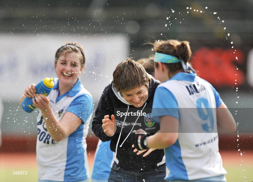 26 April 2009; Mary Logue, UCD head coach, has water thrown over her as UCD celebrate at the end of the game. ESB Irish Senior Women's Cup Final, Pegasus v UCD, National Hockey Stadium, UCD, Dublin. Picture credit: David Maher / SPORTSFILE