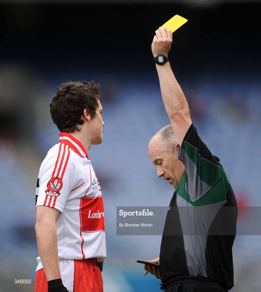 26 April 2009; Dermot McBride, Derry, is shown a yellow card by referee Marty Duffy. He is the last player to leave the field  after being shown a yellow card under the current sanctions which will not be enforced in the 2009 All-Ireland Championship. Allianz GAA National Football League, Division 1 Final, Kerry v Derry, Croke Park, Dublin. Picture credit: Brendan Moran / SPORTSFILE