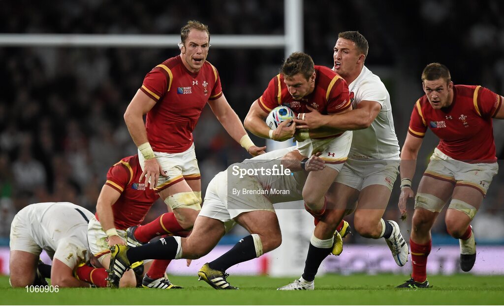 26 September 2015; Dan Biggar, Wales, is tackled by Tom Youngs, left, and Sam Burgess, England. 2015 Rugby World Cup, Pool A, England v Wales, Twickenham Stadium, London, England. Picture credit: Brendan Moran / SPORTSFILE
