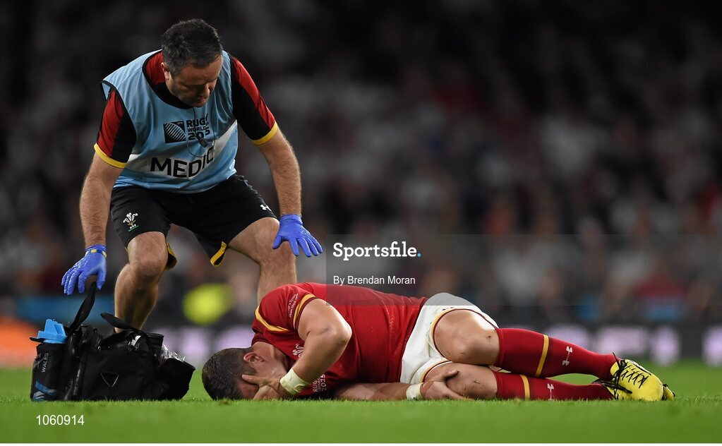 26 September 2015; Scott Williams, Wales, lies injured before being taken off the pitch on a stretcher. 2015 Rugby World Cup, Pool A, England v Wales, Twickenham Stadium, London, England. Picture credit: Brendan Moran / SPORTSFILE