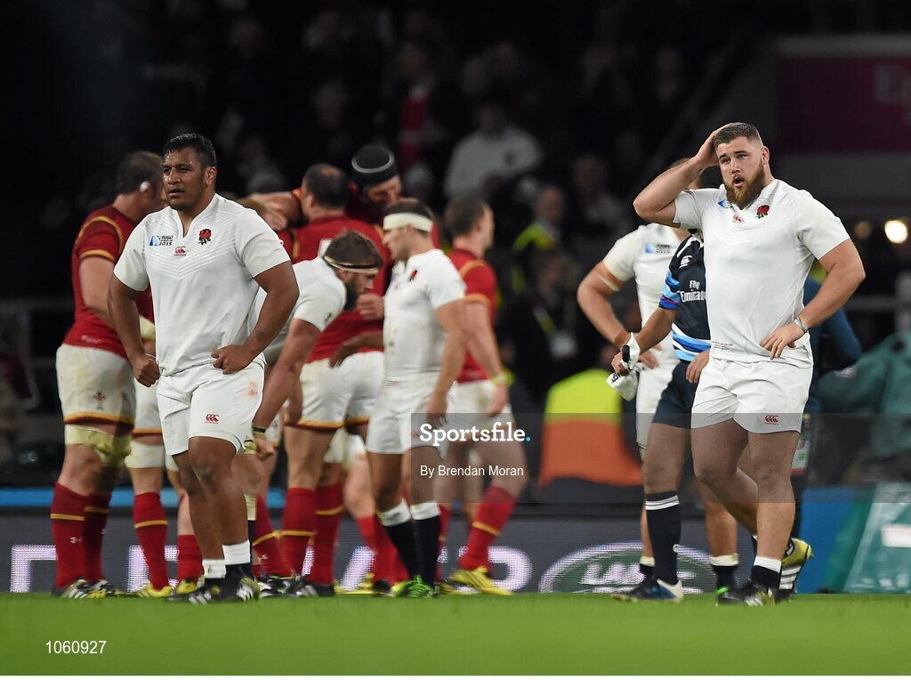 26 September 2015; Dejected England players Mako Vunipola, left, and Kieran Brookes look on after the final whistle. 2015 Rugby World Cup, Pool A, England v Wales, Twickenham Stadium, London, England. Picture credit: Brendan Moran / SPORTSFILE