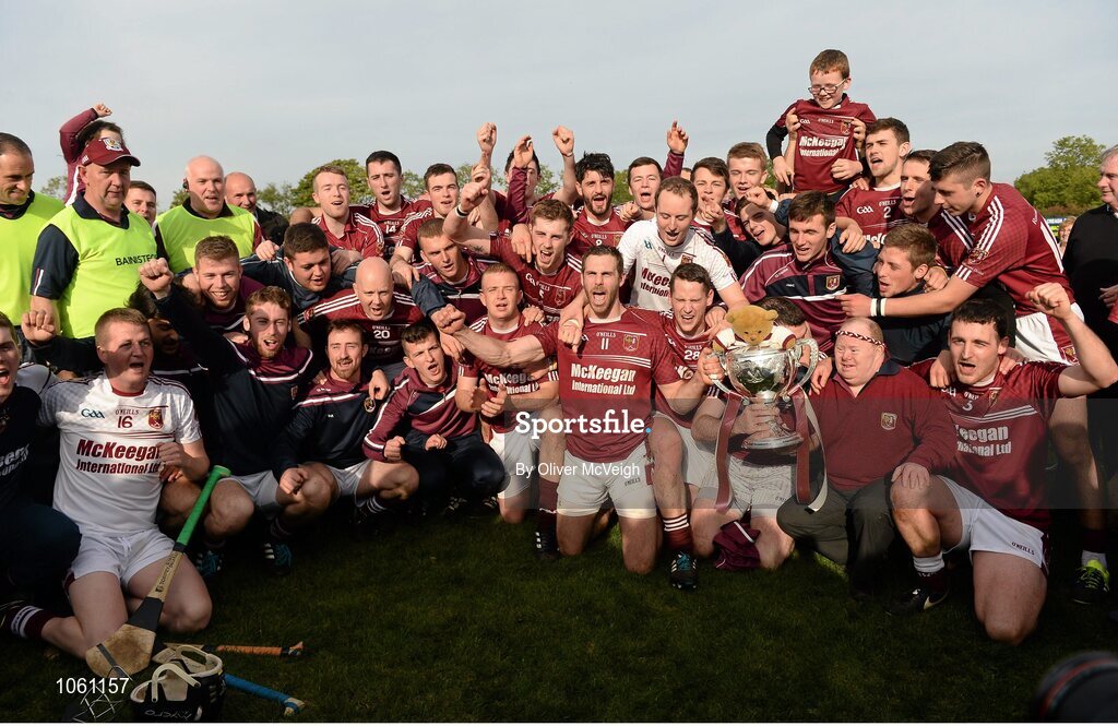 27 September 2015; Ruairi Og Cushendall players celebrate with the Volunteer cup. Antrim Senior Championship Hurling Final, Ruairi Og Cushendall v Ballycastle McQuillan, Dunloy GAA Club, Dunloy, Co. Antrim. Picture credit: Oliver McVeigh / SPORTSFILE