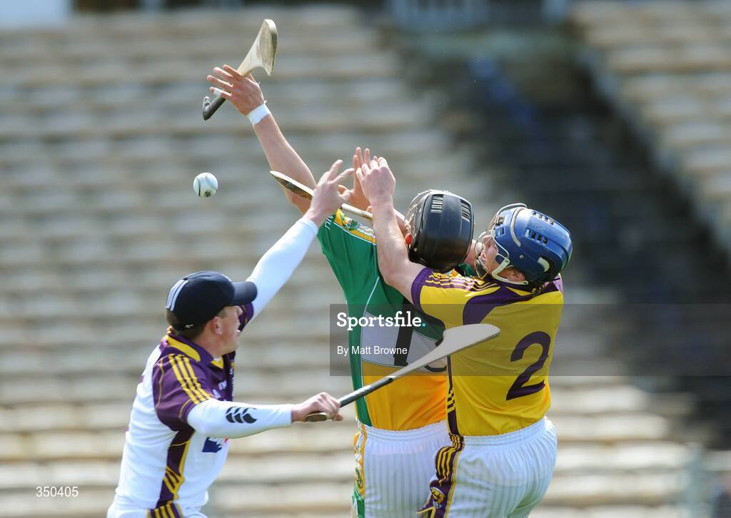 3 May 2009; Offaly's Daniel Currams scores the opening goal of the game despite the attempts of Wexford goalkeeper Dermot Flynn and Malachy Travers, 2. Allianz GAA NHL Division 2 Final, Wexford v Offaly, Semple Stadium, Thurles, Co. Tipperary. Picture credit: Matt Browne / SPORTSFILE