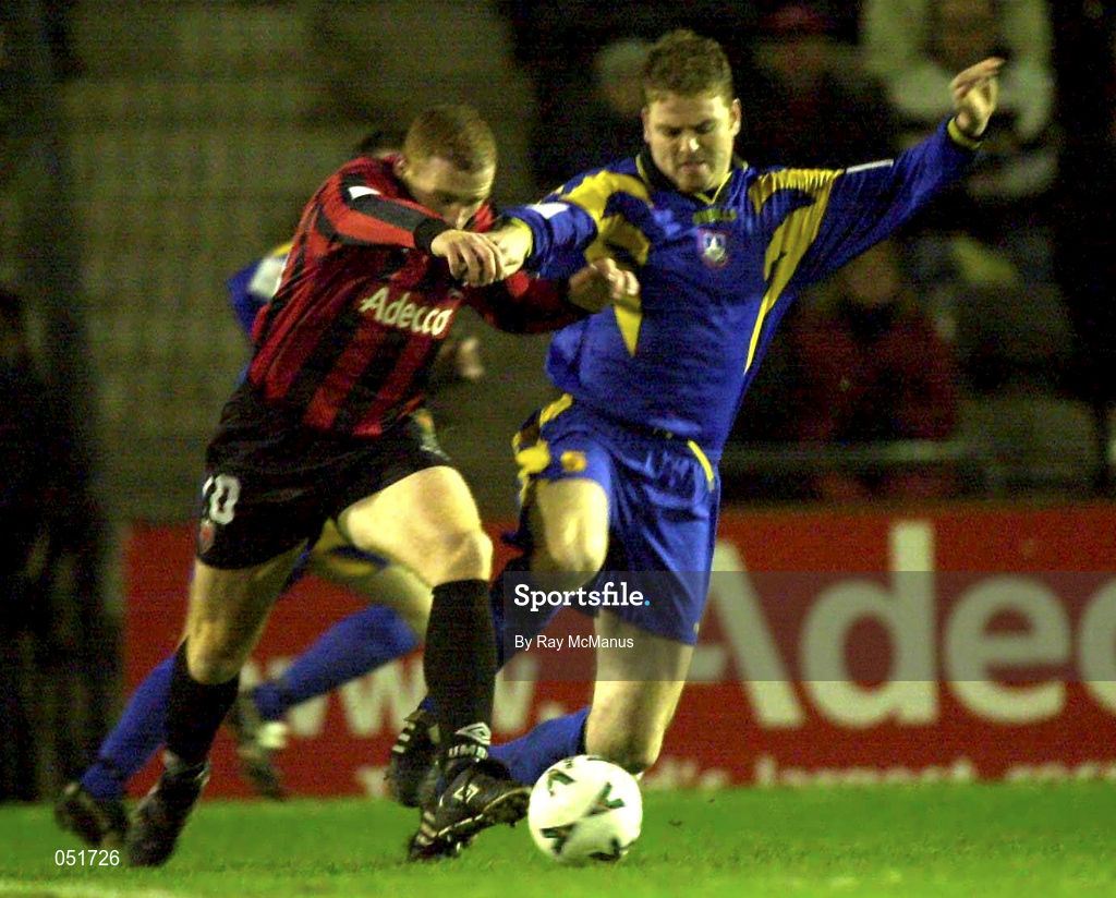 21 December 2000; Eric Smith of Longford Town in action against Glen Crowe of Bohemians during the Eircom League Premier Division match between Bohemians and Longford Town at Dalymount Park in Dublin. Photo by Ray McManus/Sportsfile