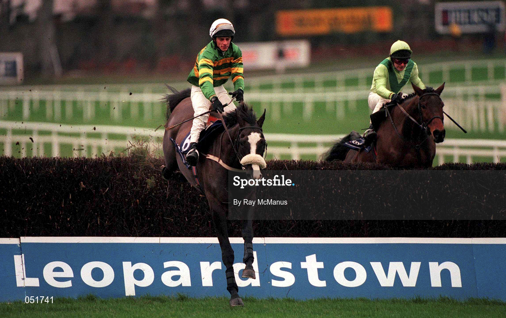 26 December 2000; Knife Edge, with Tom Rudd up, in the colours of JP McManus, jumps the last, ahead of Alcapone, with David Casey up, on their way to winning The Denny Gold Medal Novice Steeplechase during day one of the Christmas Festival at Leopardstown Racecourse in Dublin. Photo by Ray McManus/Sportsfile