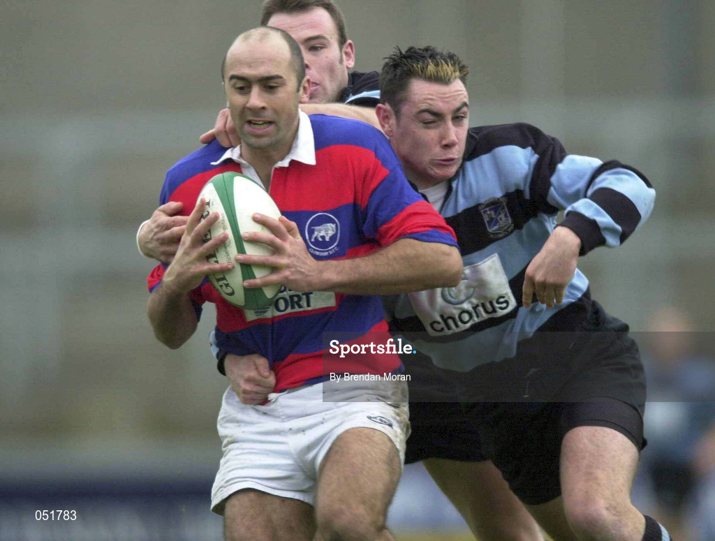 31 December 2000; Kevin Nowlan of Clontarf is tackled by Niall McNamara and John O'Neill of Shannon during the AIB All-Ireland League Division 1 match between Shannon and Clontarf at Thonond Park in Limerick. Photo by Brendan Moran/Sportsfile
