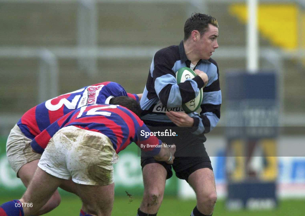 31 December 2000; Niall McNamara of Shannon is tackled by David O'Brien, 12, and Alan Reddan, 13, of Clontarf during the AIB All-Ireland League Division 1 match between Shannon and Clontarf at Thonond Park in Limerick. Photo by Brendan Moran/Sportsfile