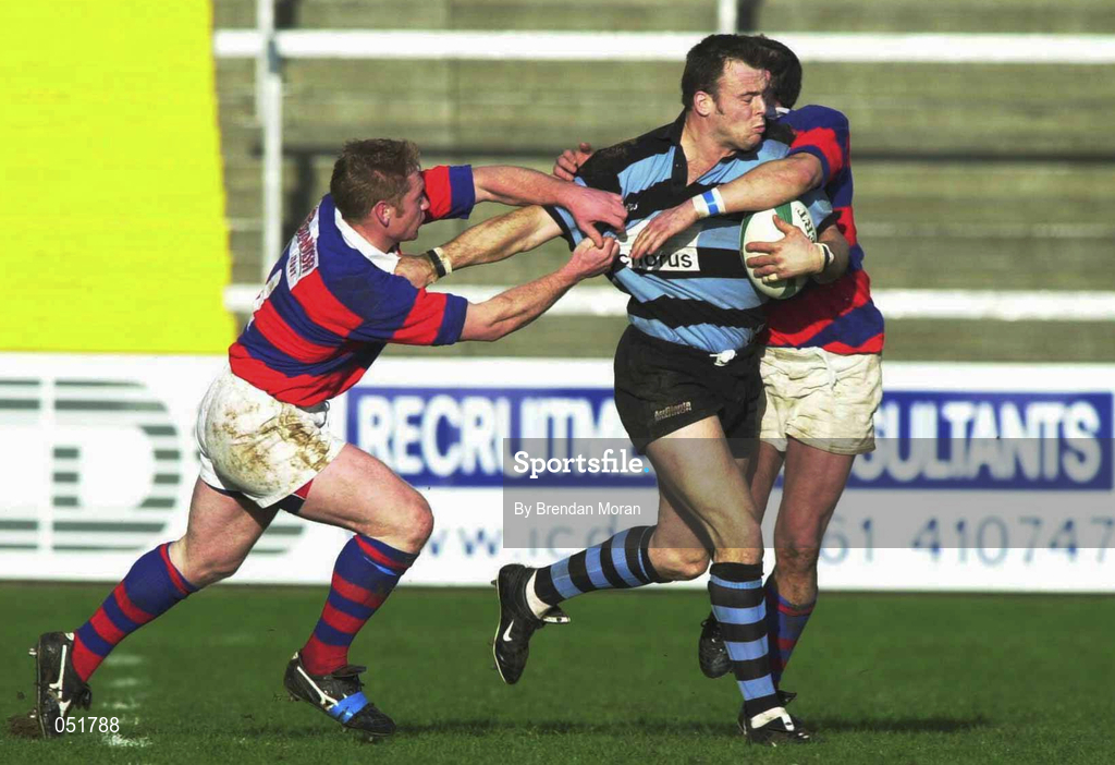 31 December 2000; John O'Neill of Shannon is tcakled by Donovan Rossi, left, and David O'Brien of Clontarf during the AIB All-Ireland League Division 1 match between Shannon and Clontarf at Thonond Park in Limerick. Photo by Brendan Moran/Sportsfile