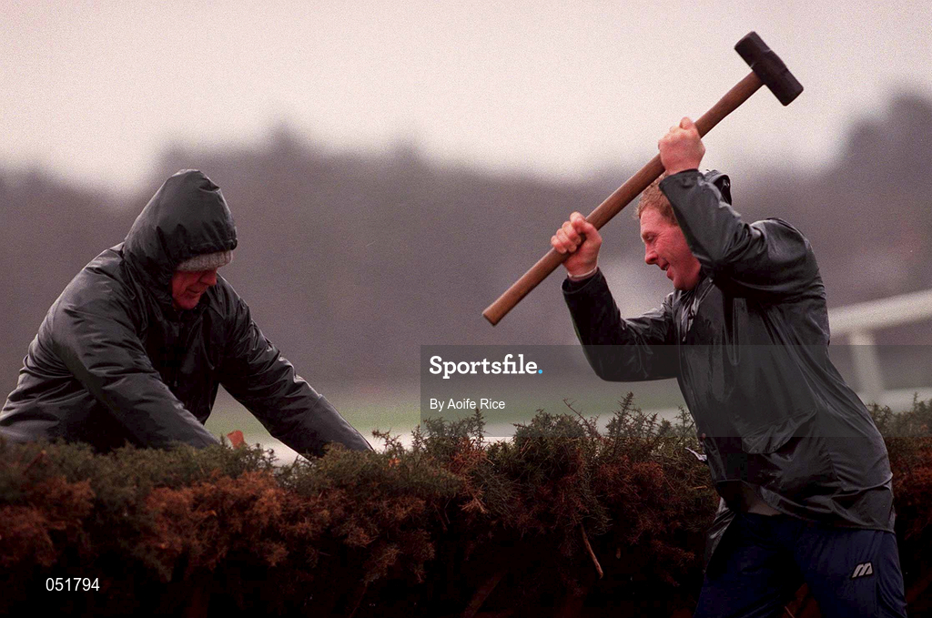 31 December 2000; Race stewards attempt to mend the Hurdle in windy conditions during day three of the Christmas Festival at Leopardstown Racecourse in Dublin. Photo by Aoife Rice/Sportsfile
