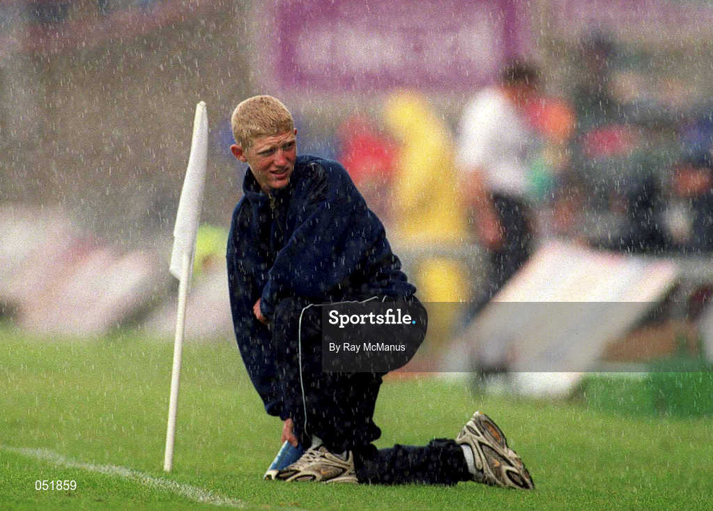 9 July 2000; A water boy waits along the sideline in the rain during the Guinness Leinster Senior Hurling Championship Final match between Kilkenny and Offaly at Croke Park in Dublin. Photo by Ray McManus/Sportsfile