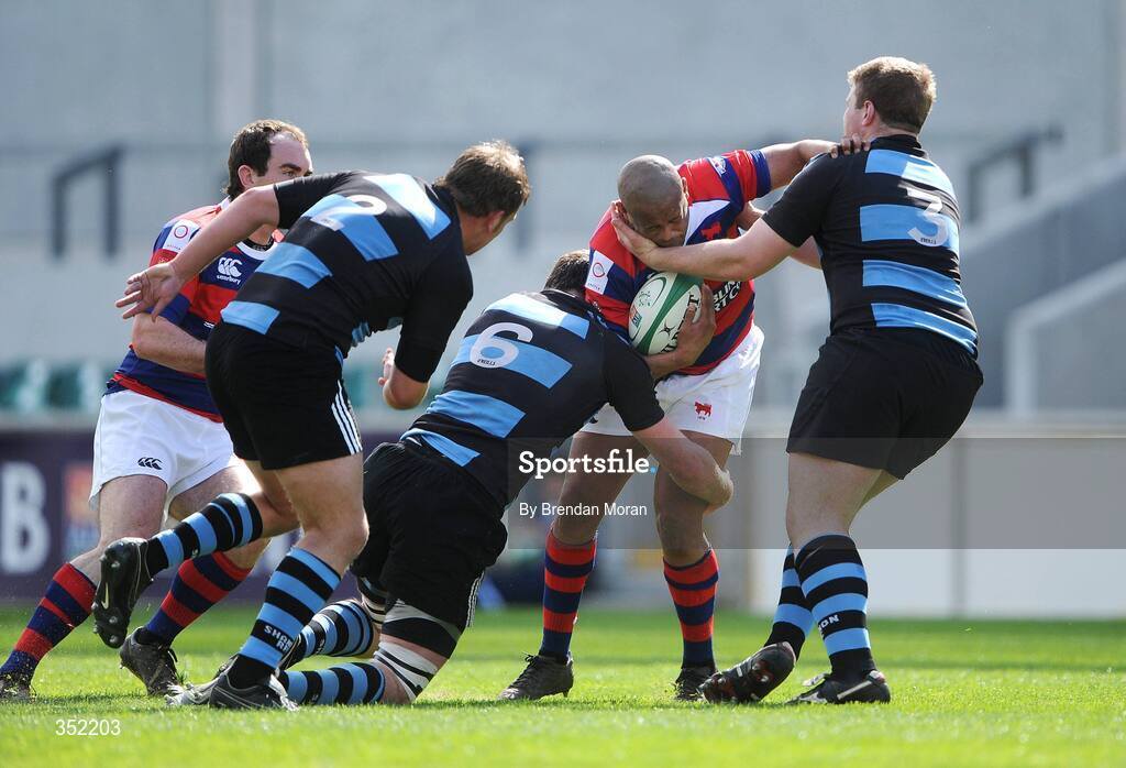 9 May 2009; Heinrich Stride, Clontarf, is tackled by Mike Essex, no.2, Donncha Ryan, no.6 and Kevin Griffin, Shannon. AIB League Division 1 Final, Shannon v Clontarf, Thomond Park, Limerick. Picture credit: Brendan Moran / SPORTSFILE