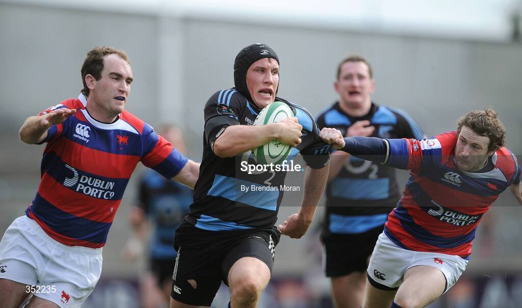 9 May 2009; Eoghan Grace, Shannon, escapes the tackles of Daragh O'Shea, left, and Phil Howard, Clontarf. AIB League Division 1 Final, Shannon v Clontarf, Thomond Park, Limerick. Picture credit: Brendan Moran / SPORTSFILE
