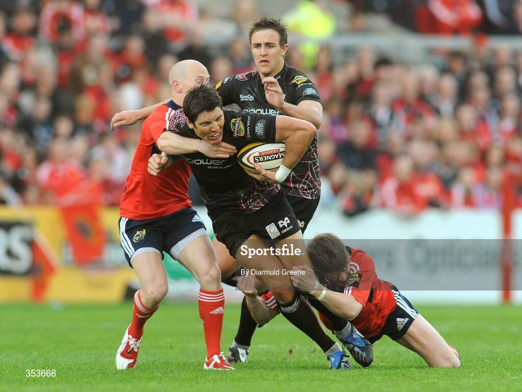 15 May 2009; James Hook, Ospreys, is tackled by Peter Stringer, left, and Ronan O'Gara, Munster. Magners League, Munster v Neath Swansea Ospreys, Thomond Park, Limerick. Picture credit: Diarmuid Greene / SPORTSFILE