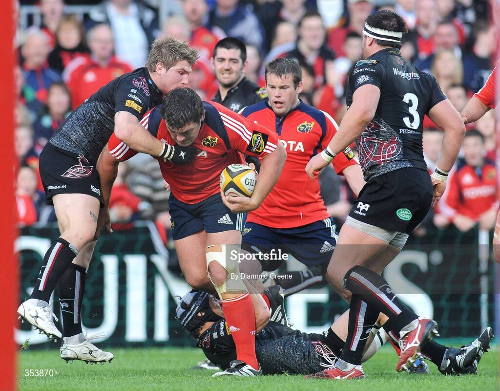 15 May 2009; Tony Buckley, Munster, is tackled by Richard Hibbard, left, Marty Holah, and Cai Griffiths, no.3, Ospreys. Magners League, Munster v Neath Swansea Ospreys, Thomond Park, Limerick.  Picture credit: Diarmuid Greene / SPORTSFILE